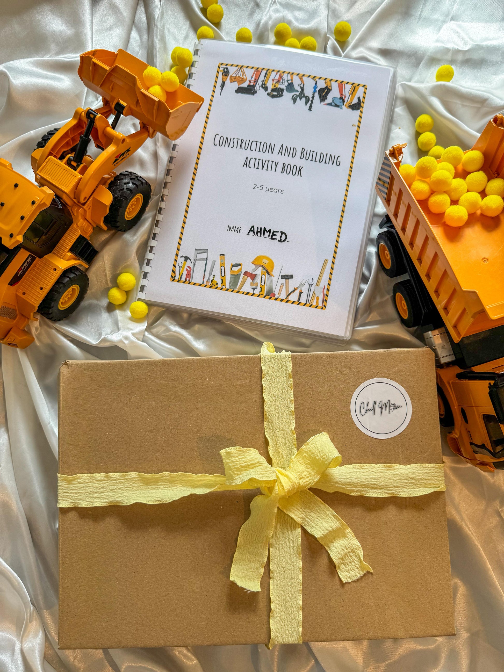 Construction activity box for toddlers with building and learning materials