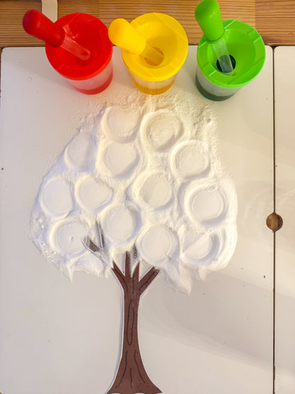 Tree-shaped mold with foam bubbles on a white surface